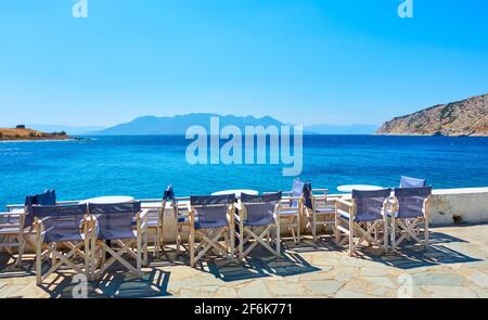Aegina Island in Greece. Open air cafe by the sea in Perdika village Stock Photo