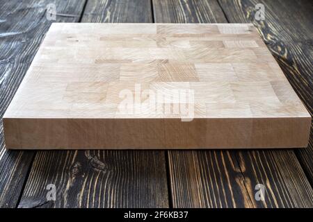 Chopping board on textured background Stock Photo