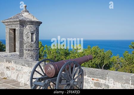 Watchtower and old cannon at 18th century colonial Fuerte de San Miguel / Fort of San Miguel looking over the Gulf of Mexico near the city Campeche Stock Photo
