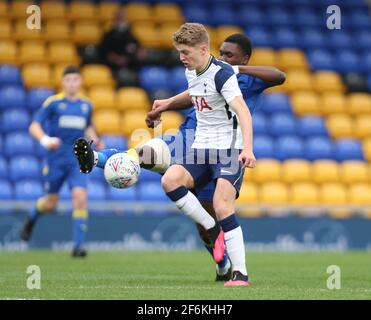 WIMBLEDON ENGLAND - MARCH  31: Matthew Craig of Tottenham Hotspur Under 18s under pressure from Obed Yeboah of AFC Wimbledon  during FA Youth Cup Four Stock Photo