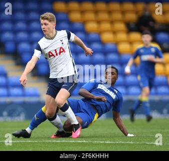 WIMBLEDON ENGLAND - MARCH  31: Matthew Craig of Tottenham Hotspur Under 18s under pressure from Obed Yeboah of AFC Wimbledon  during FA Youth Cup Four Stock Photo