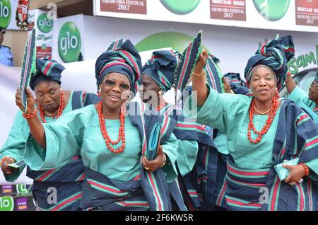 Nigerian women showcasing their traditional attire in paying homage to the traditional ruler of Ijebu Land during the Ojude Oba Festival in Nigeria. Stock Photo