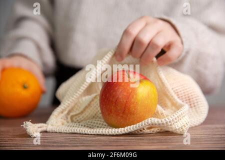 apples in an environmentally friendly bag, Eco friendly bag with red fresh apples with copy space, Fruit,Health,environment concept Stock Photo