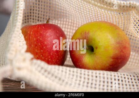 apples in an environmentally friendly bag, Eco friendly bag with red fresh apples with copy space, Fruit,Health,environment concept Stock Photo