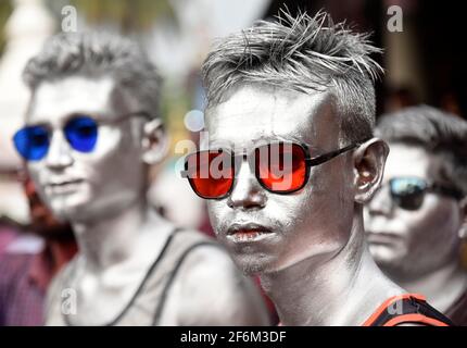 Barpeta, India. 29th Mar, 2021. People celebrate Holi festival at Barpeta Satra Namghar ground, amid COVID-19 coronavirus pandemic, at Barpeta, India. Devotee celebrate with a spontaneous expression of joy by playing with coloured powder and singing Holi songs. Credit: David Talukdar/Alamy Live News Stock Photo