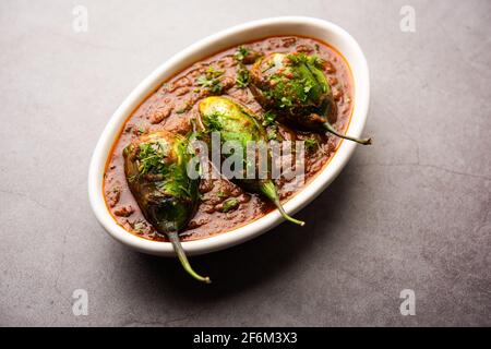 Brinjal curry also known as spicy baingan or eggplant masala, a popular main course recipe from India served in a bowl, karahi or pan Stock Photo