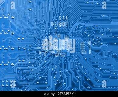 Closeup of computer electronic circuit board in blue tone. Stock Photo