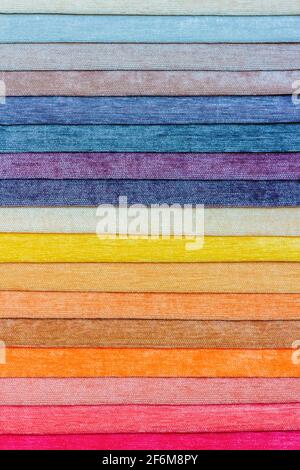 Samples of colored fabric with a brightly expressed rough texture. Vertical photography Stock Photo