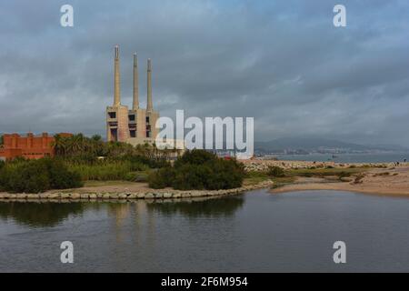 Landscape with an old disused thermal power station for the production of electric energy in Barcelona Spain Stock Photo