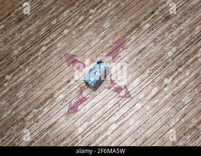 Vintage blue steamer trunk standing on huge plane of rustic planks. 3d illustration. Stock Photo