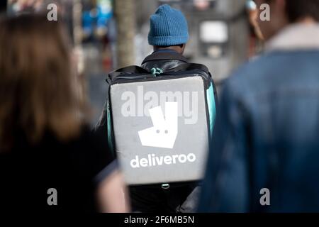 CARDIFF, WALES - MARCH 08: A Deliveroo rider at work on March 08, 2020 in Cardiff, Wales. Stock Photo