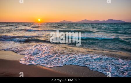Beautiful beach sunset with no people. Marmari, Kos island, Greece. Dodecanese islands, Aegean Sea. Stock Photo