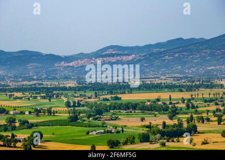 The Spoleto plain from the town of Gualdo Cattaneo, Terni, Umbria, with Assisi in the distance Stock Photo
