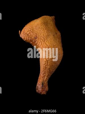 Appetizing smoked chicken legs, Ice, on a black background in isolation poultry meat, chicken smoked meat Stock Photo