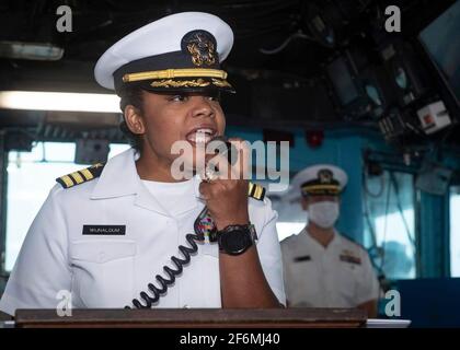 U.S. Navy Cmdr. Kathryn Wijnaldum, the new commanding officer of the Harpers Ferry-class dock landing ship USS Oak Hill, addresses sailors during the change of command ceremony September 17, 2020 in Virginia Beach, Virginia. Stock Photo