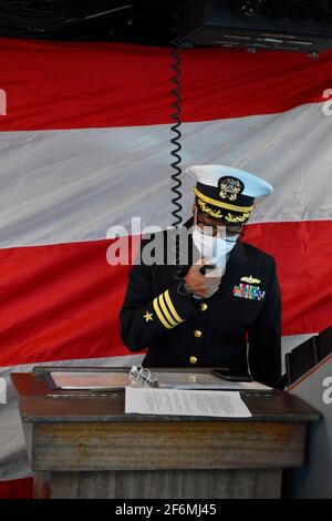 U.S. Navy Cmdr. LaDonna M. Simpson, commanding officer of the Harpers Ferry-class amphibious dock landing ship USS Carter Hall address sailors during a change of command ceremony January 21, 2021 in Virginia Beach, Virginia. Stock Photo