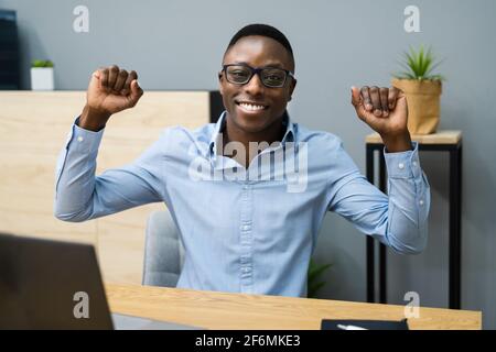 African Black Business Man Celebrating Hands Raised Stock Photo