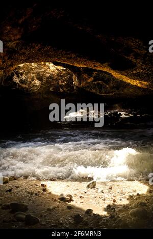 Spectacular Mermaid Caves with sunlight piercing through hole in ...