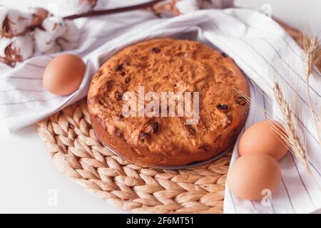 Easter cake and eggs on wicker cloth. Top view copy space. Isolated on white. Cookies pie or cake recipe Stock Photo