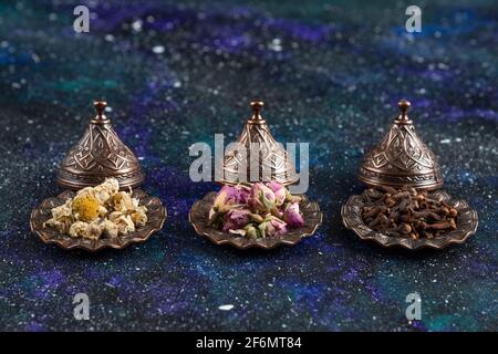 Different herbs and spices on blue background Stock Photo