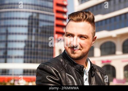 An attractive man wearing black leather jacket Stock Photo
