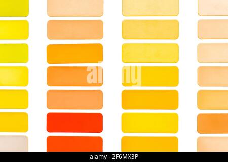 Samples of different shades of yellow and orange in squares on a white background isolated colorful abstract mosaic texture. Stock Photo