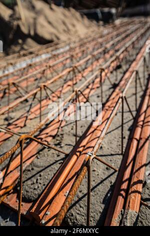 Close up on lattice girder and truss girders steel roof truss for concrete precast with ceramic elements ready for installation on the construction si Stock Photo