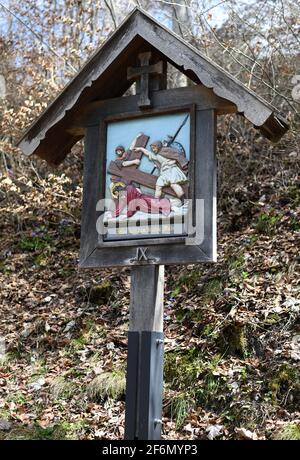 Eschenlohe, Germany. 01st Apr, 2021. The ninth station on a Way of the Cross up to St. Nicholas on the Vestbichl shows 'Jesus falls for the third time'. Credit: Angelika Warmuth/dpa/Alamy Live News Stock Photo