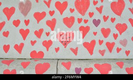 Red hearts seen on the National Covid Memorial Wall in London.The National Covid Memorial Wall in London outside St Thomas' Hospital is being hand-painted with 150000 hearts to honors UK Covid-19 victims. (Photo by Thomas Krych / SOPA Images/Sipa USA)