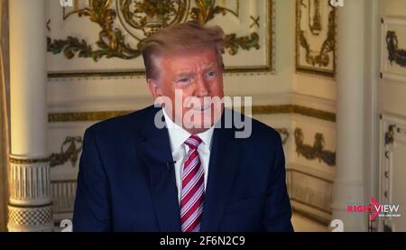 April 01, 2021, Palm Beach, Florida, USA - Former president DONALD TRUMP sits down for an interview with his daughter-in-law, Lara Trump. The interview was subsequently scrubbed from the Facebook and Instagram platforms. Trump is under indefinite suspension from social media for his role in inciting the insurrection and deadly riot on January 6 at the Capitol.(Credit Image: © The Right View/ZUMA Wire) Stock Photo