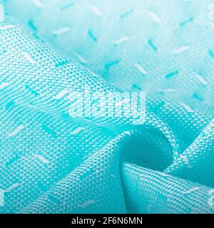 Texture, background, template. Silk other Cotton fabric turquoise and aqua, silk other Cotton drapery. In closeup, threads of fabric and a pattern of Stock Photo