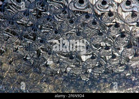 Abstract background of glass light bubbles hanging over garden conservatory. Stock Photo