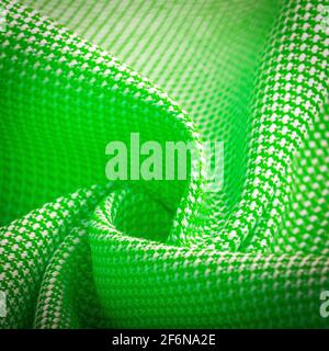 Texture, background, template. Silk other Cotton fabric green color, silk other Cotton drapery. In closeup, threads of fabric and a pattern of texture Stock Photo