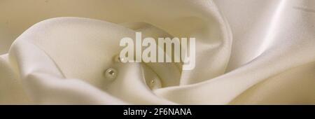 White silk fabric lines. High resolution background texture, decorative basis for design. Closeup of rippled Stock Photo