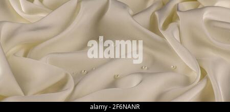 White silk fabric lines. High resolution background texture, decorative basis for design. Closeup of rippled Stock Photo