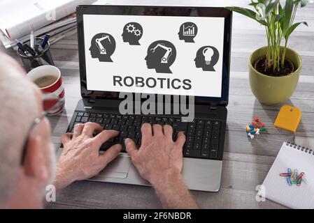 Robotics concept shown on a laptop used by a man Stock Photo