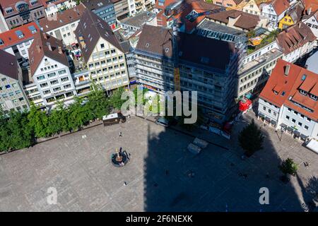 ULM, GERMANY, 7 AUGUST 2020: the shadow of Ulm cathedral, tallest church in the world, over the main square, aerial view Stock Photo