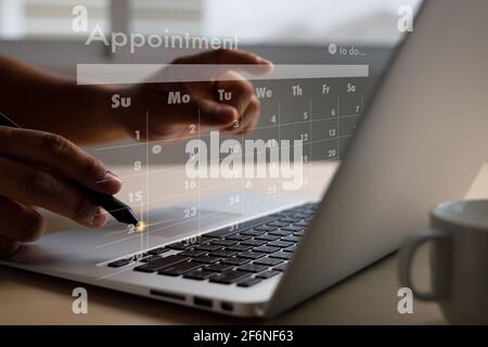 man work business writing working and schedule Calendar busy schedule tasks and appointments in Weekly Planner Schedule Stock Photo