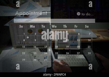 man work business writing working and schedule Calendar busy schedule tasks and appointments in Weekly Planner Schedule Stock Photo