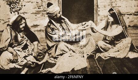 A press photo from 1911 showing a scene from the play KISMET with Oscar Asche and Lily Brayton  --- John Stange(or Stranger ) Heiss Oscar Asche (1871 – 1936), better known as Oscar Asche, was an Australian actor and director who is well known for having written, directed, and acted in the record-breaking musical Chu Chin Chow with  Lily Brayton (Elizabeth 'Lily' Brayton ( 1876 –  1953) who was an English actress and singer, known for her  Shakespearian acting. She appeared in many plays including  almost 2,000 performances in the First World War hit musical Chu Chin Chow. Stock Photo