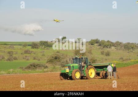 A planter is a farm implement, usually towed behind a tractor, that sows (plants) seeds in rows throughout a field Stock Photo