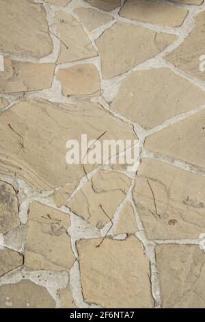 Background made from paving stones, floor texture, irregular natural stones on the ground, exterior, outdoors Stock Photo