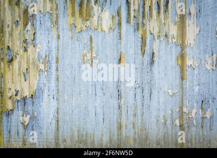 Corrugated iron pattern, texture or background. Rusty grunge style with weathered, distressed paint, UK Stock Photo