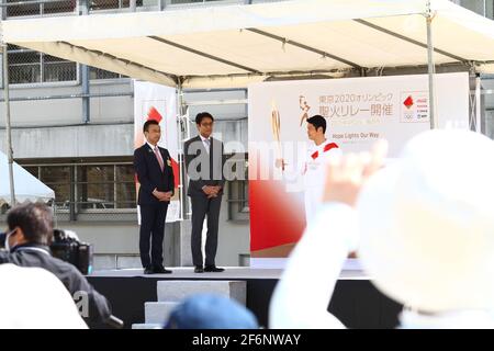 Iida, Japan, 02/04/2021, Olympic torch event in iida city. Runner and holder of the torch showing the lighted torch to the people. Stock Photo