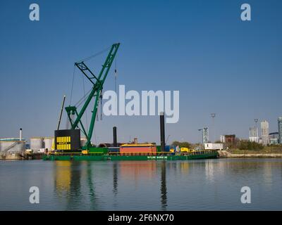 The 250 tonne crane Skylift 2 operating on the submersible Skyline Barge 26 while lifting equipment at docks in Alfred Dock, Birkenhead on the River M Stock Photo