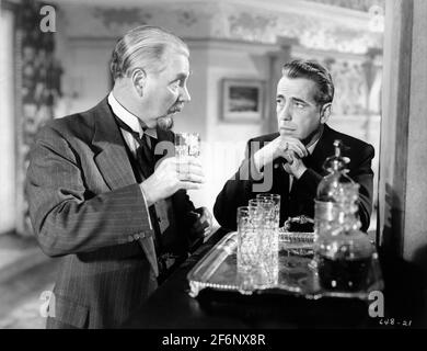 NIGEL BRUCE and HUMPHREY BOGART in THE TWO MRS. CARROLLS 1947 director PETER GODFREY original play Martin Vale gowns for Barbara Stanwyck by Edith Head producer Mark Hellinger Warner Bros. Stock Photo