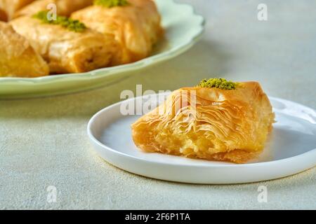 Sweets arabic dessert baklava, , kunafa, kadayif with pistachio nuts and cheese . Closeup Stock Photo