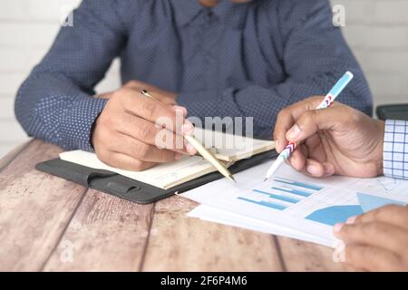 young people analyzing financial data on office desk  Stock Photo
