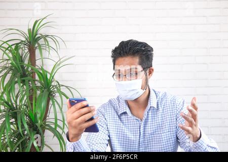 Businessman In a video conference discussing on smart phone  Stock Photo