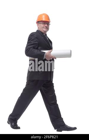 Side view of happy engineer walking isolated on white background Stock Photo